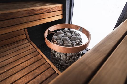 Traditional wooden sauna with stone heater illustrating sauna health benefits