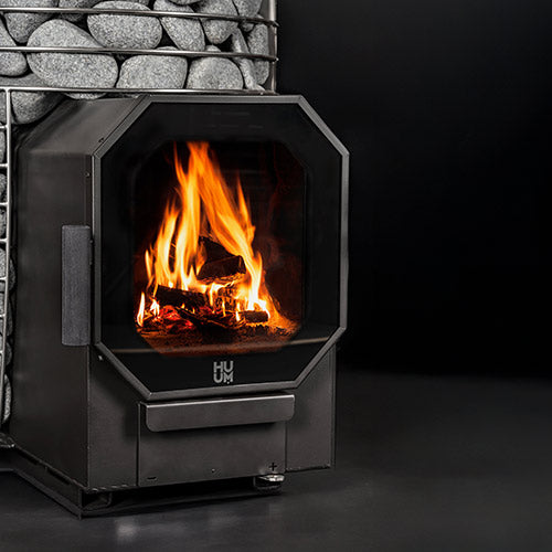 HUUM HIVE Flow wood-burning sauna stove wood fire in use