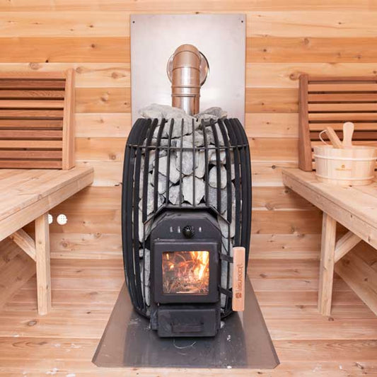Leisurecraft TimberGlow14 wood-burning sauna heater installed in a cedar sauna